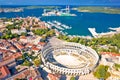 Arena Pula. Ancient ruins of Roman amphitheatre and Pula waterfront aerial view