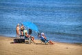 People sunbathing and relaxing in a Sunny day on the beach Royalty Free Stock Photo