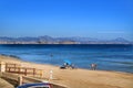 People sunbathing and relaxing in a Sunny day on the beach Royalty Free Stock Photo