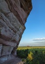 Arenite rock, in Jalapao, Brazil, contrasting with the blue sky and green fields.