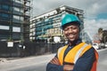 Arent they beautiful My company built them. Portrait of a confident young man working at a construction site. Royalty Free Stock Photo