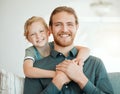 Arent we like twins. an adorable little girl hugging her father during a day at home. Royalty Free Stock Photo