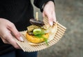 Arepa, Colombian corn patties, with blood sausage, head cheese, and zucchini.