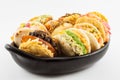 Arepas with assorted fillings served in a black ceramic dish Royalty Free Stock Photo