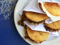 Arepas filled with shredded meat and cheese.Venezuelan typical dish. Traditional Colombian food. Royalty Free Stock Photo