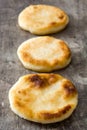 Arepas on wooden table. Venezuelan typical food