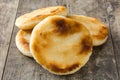 Arepas on wooden table. Venezuelan typical food