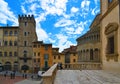 AREZZO, ITALY. Cityscape with Piazza Grande square in Arezzo with facade of old historical buildings and crowd of peopl