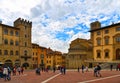 AREZZO, ITALY. Cityscape with Piazza Grande square in Arezzo with facade of old historical buildings and crowd of peopl