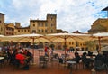 AREZZO, ITALY. Cityscape with Piazza Grande square in Arezzo with facade of old historical buildings and people relaxin