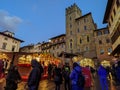 AREZZO, ITALY - NOVEMBER 26, 2022: View of the tyrolean christmas market in the center of Arezzo city during dusk, Italy