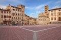 Arezzo, Tuscany, Italy: the main square Piazza Grande with the medieval church and buildings Royalty Free Stock Photo