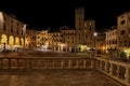 Arezzo, Tuscany, Italy: night view of the main square Piazza Grande with the medieval buildings Royalty Free Stock Photo