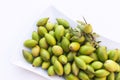 Argan nuts in a white plate.