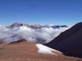 Argentina - Famous peaks - Hiking in Cantral Andes - Peaks around us - - morning clouds below the camp Royalty Free Stock Photo