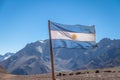 Argentina flag with Cerro Tolosa Mountain on background in Cordillera de Los Andes - Mendoza Province, Argentina Royalty Free Stock Photo