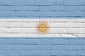 Argentina flag depicted in paint colors on old brick wall. Textured banner on big brick wall masonry background Royalty Free Stock Photo