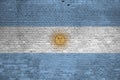 Argentina flag depicted in paint colors on old brick wall. Textured banner on big brick wall masonry background Royalty Free Stock Photo