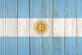 Argentina flag painted on old wood plank background. Brushed natural light knotted wooden board texture. Wooden texture Royalty Free Stock Photo