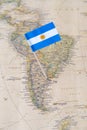 Argentina flag pin on a world map Royalty Free Stock Photo