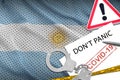 Argentina flag and police handcuffs with inscription Don`t panic on white paper. Coronavirus or 2019-nCov virus concept