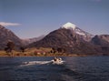 Lanin volcano panoramic view with araucaria tree, Patagonia Neuquen province, fishermen in boat in lake Royalty Free Stock Photo