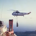 Argentine Antarctica, Sea King helicopter of the Argentine Navy descending with merchandise on the icebreaker