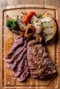 Argentine cut of meat called Vacio with chorizos and chimichurri Royalty Free Stock Photo