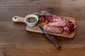 Argentine cut of meat called Vacio with chorizos and chimichurri Royalty Free Stock Photo