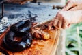 Argentine man cutting roast beef. Asado from Argentina. Barbecue Royalty Free Stock Photo