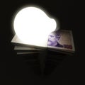 Argentine peso stack with lightbulb