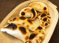 Argentinian empanadas on wood tray