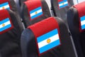 Argentinian Flag on Empty seat in plane. Travel, flight and transportration in Argentina concept Royalty Free Stock Photo