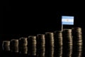 Argentinian flag with lot of coins isolated on black Royalty Free Stock Photo