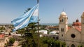 Argentinian flag waving in the wind against a blue sky, Victoria city, Entre Rios, Argentina Royalty Free Stock Photo