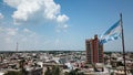 Argentinian flag waving in the wind against a blue sky, Victoria city, Entre Rios, Argentina Royalty Free Stock Photo