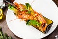 Argentinian king prawns, glazed. Lime, chilly and garlic. Served in a bottle. Delicious healthy traditional food closeup