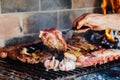 Argentinian meat roasting on the grill. Making a traditional barbecue called Asado in Argentina Royalty Free Stock Photo