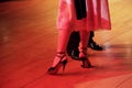 Argentinian tango couple feet in red spotlight Royalty Free Stock Photo