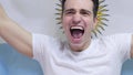 Argentinian Young Man celebrates holding the Flag of Argentina in Slow Motion Royalty Free Stock Photo