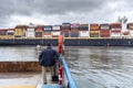 Argo ship from Hong Kong loaded with containers is towed through the channel of the Port of Santos