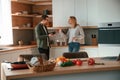 Arguing, yelling at each other. Young couple is on the kitchen together Royalty Free Stock Photo