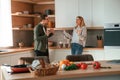 Arguing, yelling at each other. Young couple is on the kitchen together Royalty Free Stock Photo