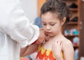 argumentative young girl is playing dress up with grandmother