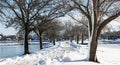 Argyle park looking east with shoveled snow path around the lakes Royalty Free Stock Photo