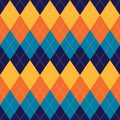 Argyle pattern multicolored fashion in navy blue, orange, yellow. Seamless classic lumberjack stitched rhombus plaid for socks. Royalty Free Stock Photo