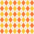 Argyle seamless pattern in classic orange shades. Fabric texture background with rhombuses, staggered. Argyle vector classic ornam