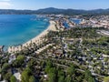 Arial view on blue water of Gulf of Saint-Tropez, sandy beach, houses in Port Grimaud, village on Mediterranean sea with yacht