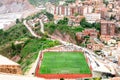Arial view of the city and football field. People enjoying sports outdoors. Cardona. Spain