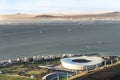 Arial view of Green point football stadium in Cape town with ocean behind it